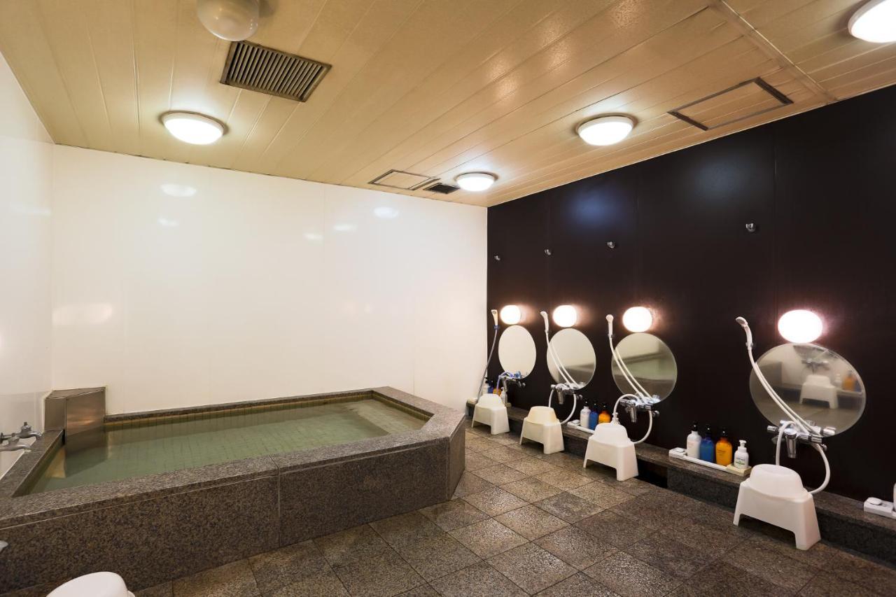Отель Capsule Land Yushima Токио Экстерьер фото